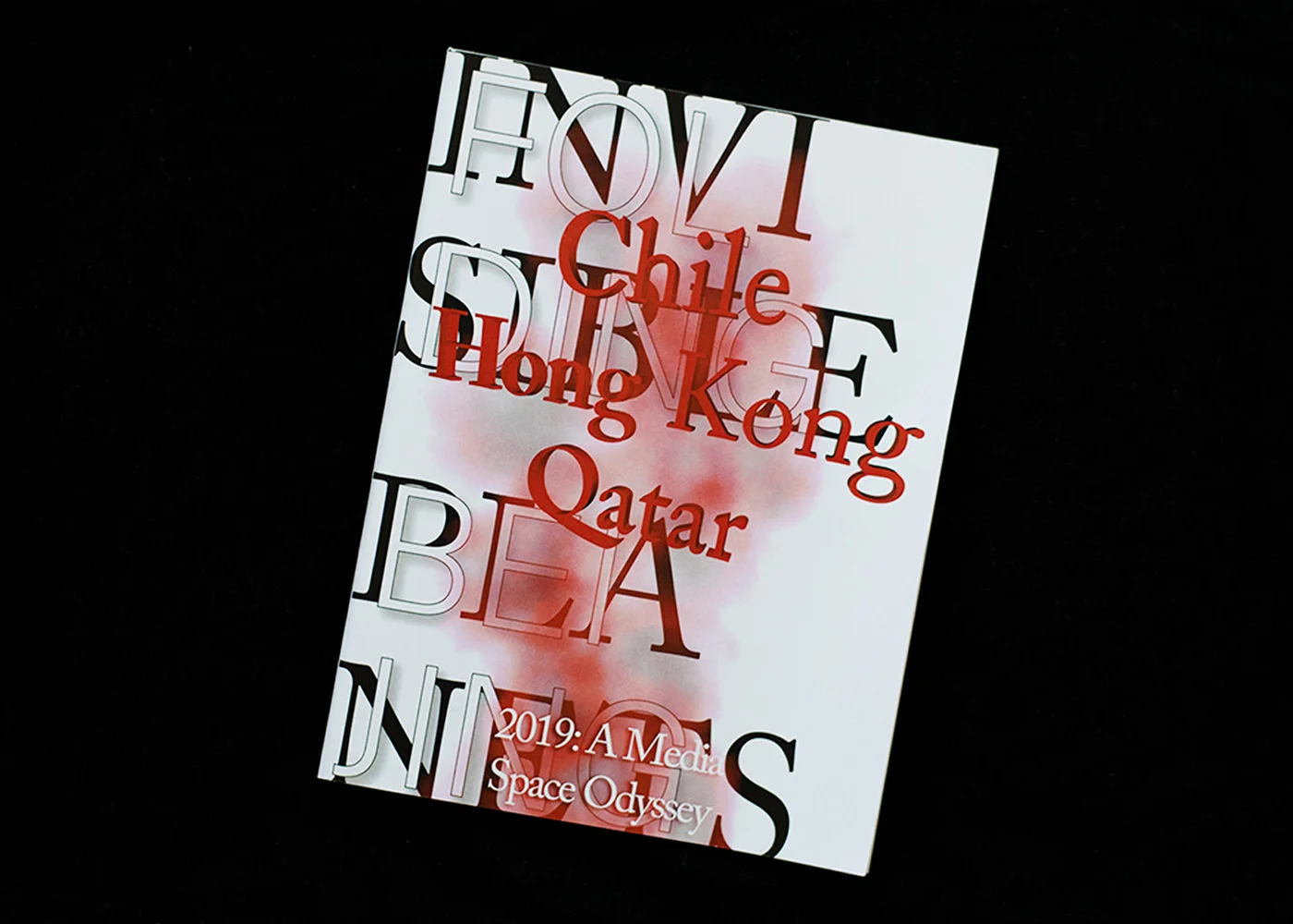 Magazine cover. The titles 'Invisible Planets' and 'Folding Beijing' are superimposed by the names Chile, Hong Kong and Qatar.